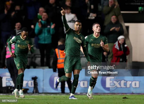 Morgan Whittaker of Plymouth Argyle celebrates scoring their team's third goal with teammates during the Sky Bet Championship match between Plymouth...