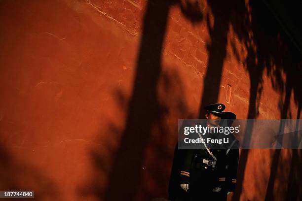 Two paramilitary policemen guard outside the Great Hall of the People where the Communist Party's 205-member Central Committee gathered for its third...