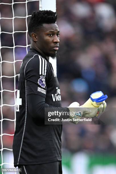 Andre Onana of Manchester United puts vaseline on his gloves during the Premier League match between West Ham United and Manchester United at London...