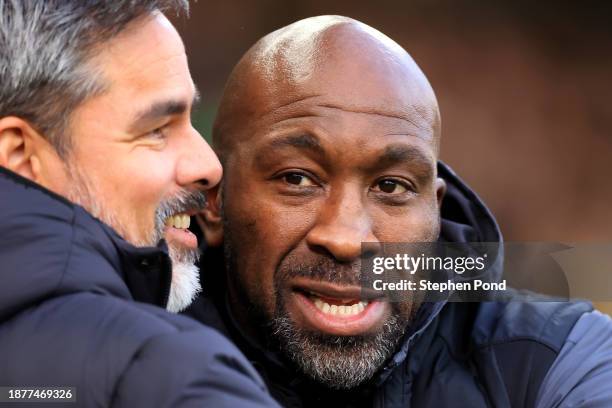 Darren Moore, Manager of Huddersfield Town embraces David Wagner, Manager of Norwich City during the Sky Bet Championship match between Norwich City...