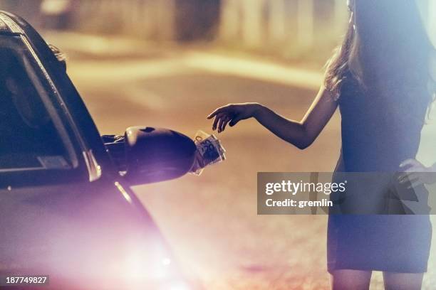 young prostitute on the street at night - prostitutie stockfoto's en -beelden