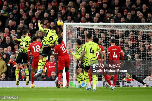 Gabriel of Arsenal scores their team's first goal during the Premier League match between Liverpool FC and Arsenal FC at Anfield on December 23, 2023...