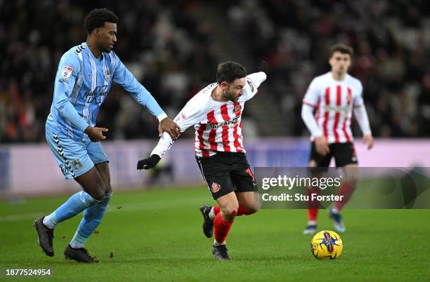 Coventry player Haji Wright challenges Patrick Roberts of Sunderland during the Sky Bet Championship match between Sunderland and Coventry City at...