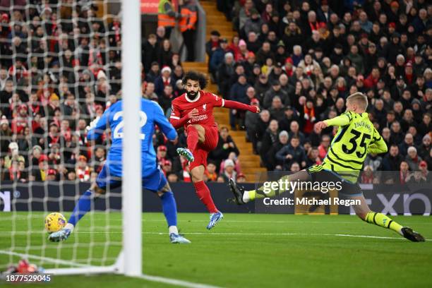 Mohamed Salah of Liverpool shoots whilst under pressure from Oleksandr Zinchenko of Arsenal and misses during the Premier League match between...