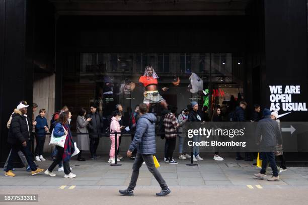 Shoppers queue outside Nike Inc. Store during traditional Boxing Day holiday sales, in London UK, on Tuesday, Dec. 26, 2023. The UK will be Europe's...