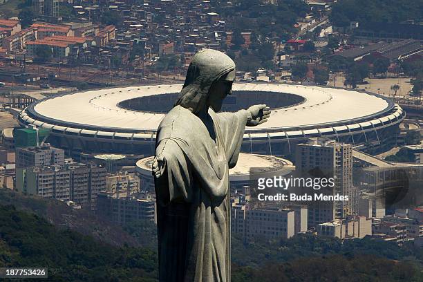 An aerial view of the Christ The Redeemer statue and the Maracana Stadium on November 12, 2013 in Rio de Janeiro, Brazil.
