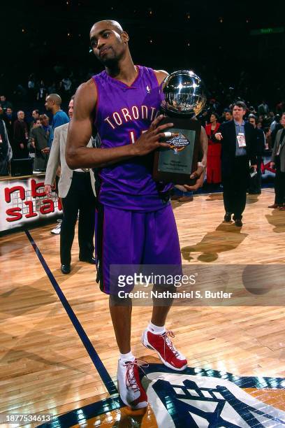 Vince Carter of the Toronto Raptors celebrates with the winning with he trophy during the 2000 NBA All Star Slam Dunk Contest at The Arena In Oakland...