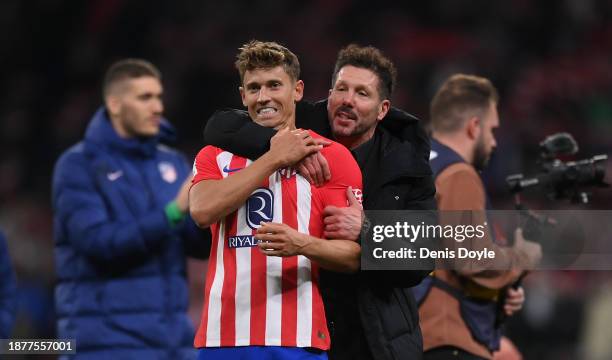 Diego Simeone, Manager of Atletico Madrid celebrates victory with Marcos Llorente of Atletico de Madrid on the final whistle of the LaLiga EA Sports...