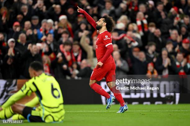 Mohamed Salah of Liverpool celebrates after scoring their team's first goal during the Premier League match between Liverpool FC and Arsenal FC at...