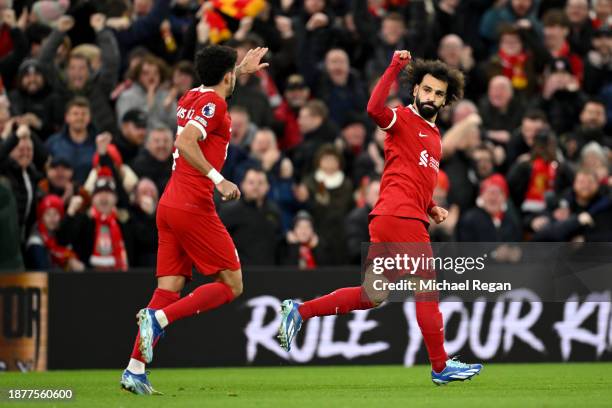 Mohamed Salah of Liverpool celebrates after scoring their team's first goal during the Premier League match between Liverpool FC and Arsenal FC at...