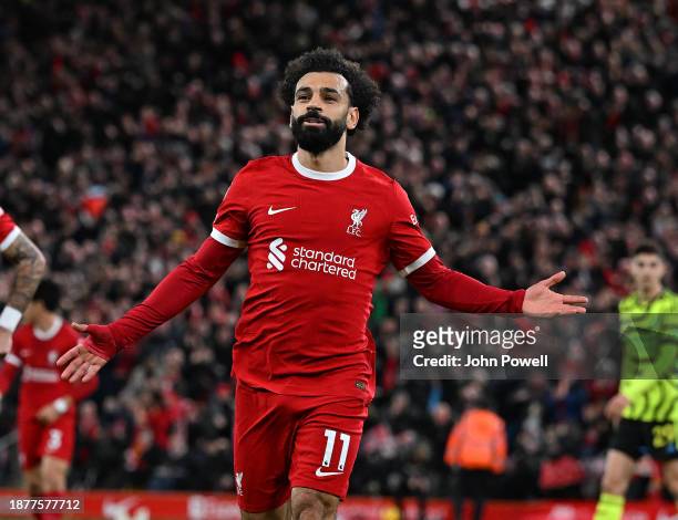 Mohamed Salah of Liverpool celebrates after scoring the first Liverpool goal during the Premier League match between Liverpool FC and Arsenal FC at...