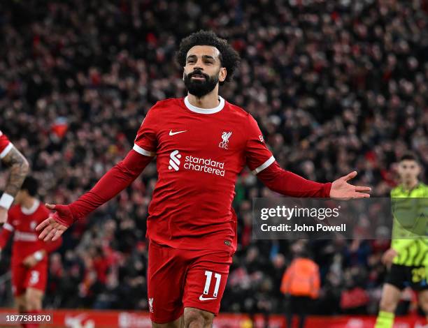 Mohamed Salah of Liverpool celebrates after scoring the first Liverpool goal during the Premier League match between Liverpool FC and Arsenal FC at...