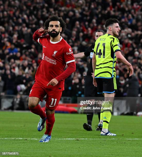 Mohamed Salah of Liverpool celebrates after scoring the first Liverpool goal during the Premier League match between Liverpool FC and Arsenal FC at...