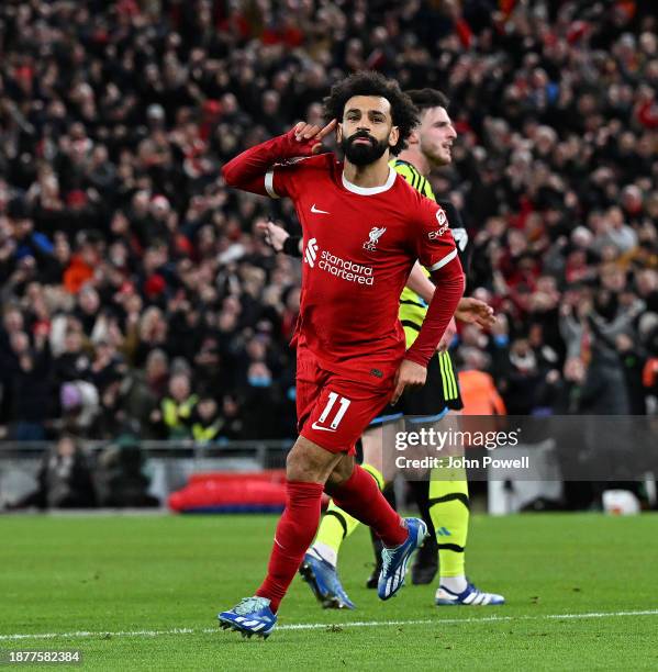 Mohamed Salah of Liverpool celebrates after scoring the first Liverpool goal during the Premier League match between Liverpool FC and Arsenal FC at...