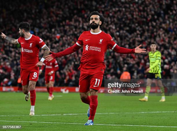 Mohamed Salah of Liverpool celebrates after scoring the first Liverpool goal during the Premier League match between Liverpool FC and Arsenal FC at...