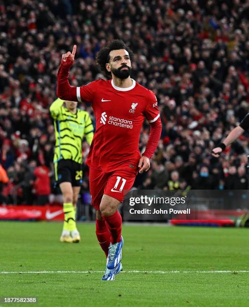 Mohamed Salah of Liverpool celebrates after scoring the first Liverpool goal during the Premier League match between Liverpool FC and Arsenal FC at...