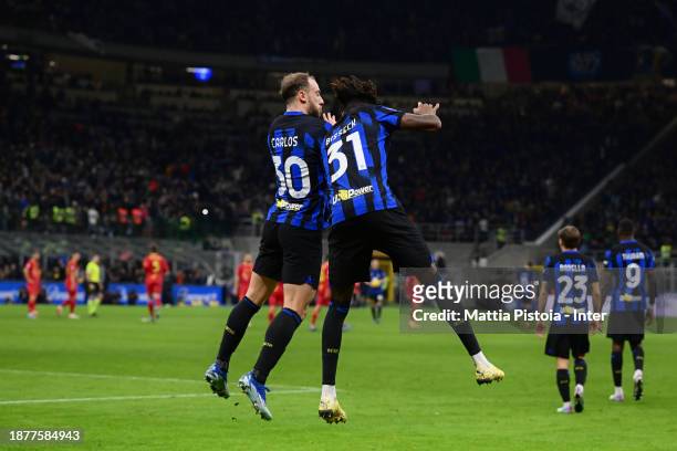 Yann Aurel Bisseck of FC Internazionale celebrates after scoring his team's first goal with teammate Carlos Augusto during the Serie A TIM match...