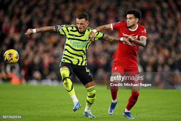 Ben White of Arsenal and Luis Diaz of Liverpool battle for possession during the Premier League match between Liverpool FC and Arsenal FC at Anfield...