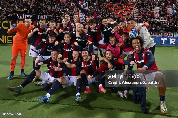 Players of Bologna FC celebrate during the Serie A TIM match between Bologna FC and Atalanta BC at Stadio Renato Dall'Ara on December 23, 2023 in...