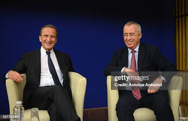 Electricite de France CEO Henri Proglio and Areva CEO Luc Oursel smile during a press conference about nuclear energy on the international market on...