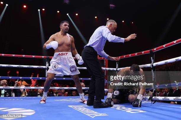 Referee Steve Gray stops the fight as Arslanbek Makhmudov is knocked down by Agit Kabayel during the WBA Inter-Continental & North American Boxing...