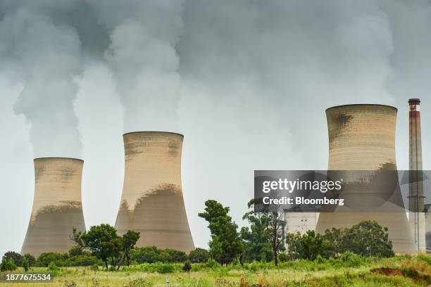 Cooling towers at the Eskom Holdings SOC Ltd. Arnot coal-fired power station in Mpumalanga, South Africa, on Tuesday, Dec. 26, 2023. Coal-fired power...