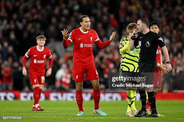Virgil van Dijk of Liverpool reacts towards Match Referee Chris Kavanagh during the Premier League match between Liverpool FC and Arsenal FC at...