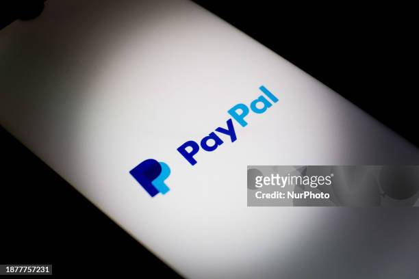 The PayPal logo is being displayed on a smartphone screen in Athens, Greece, on December 26, 2023.