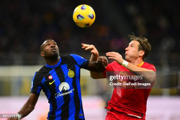 Marcos Thuram of of FC Internazionale and Federico Baschirotto of US Lecce battle for the ball during the Serie A TIM match between FC Internazionale...