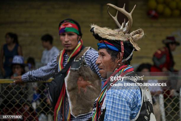 An inhabitant of the province of Chumbivilcas, in Cuzco, southern Peru, wears an animal hat while celebrating Takanakuy in San Juan de Lurigancho, on...