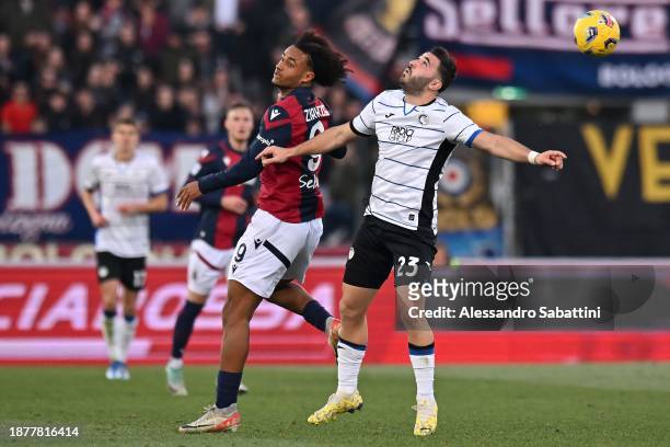 Joshua Zirkzee of Bologna FC competes for the ball with Sead Kolasinac of Atalanta BC during the Serie A TIM match between Bologna FC and Atalanta BC...