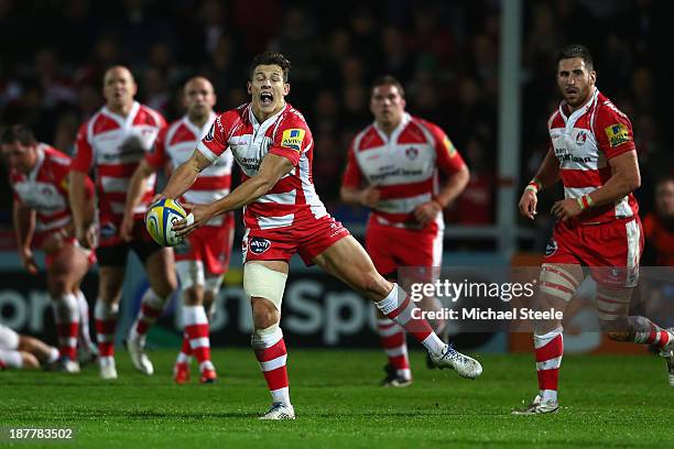 Ryan Mills of Gloucester feeds a pass during the International match between Gloucester and Japan at Kingsholm Stadium on November 12, 2013 in...