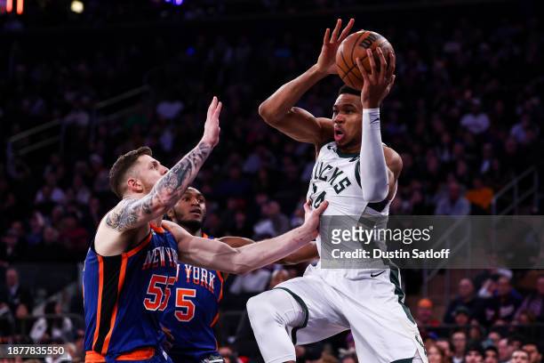 Giannis Antetokounmpo of the Milwaukee Bucks looks to pass the ball during the fourth quarter of the game against the New York Knicks at Madison...