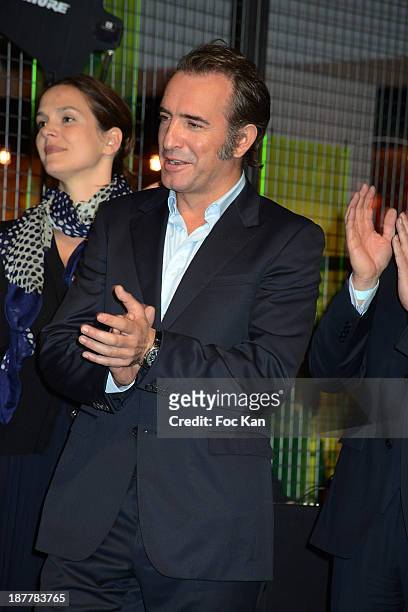 Sophie de Closets, Jean Dujardin and a guest attend the Quai Des Orfevres 2014 Literary Prize award announcement at the Police Judiciaire on November...