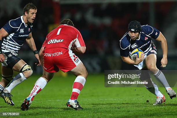 Hisateru Hirashima of Japan runs at Yann Thomas of Gloucester during the International match between Gloucester and Japan at Kingsholm Stadium on...