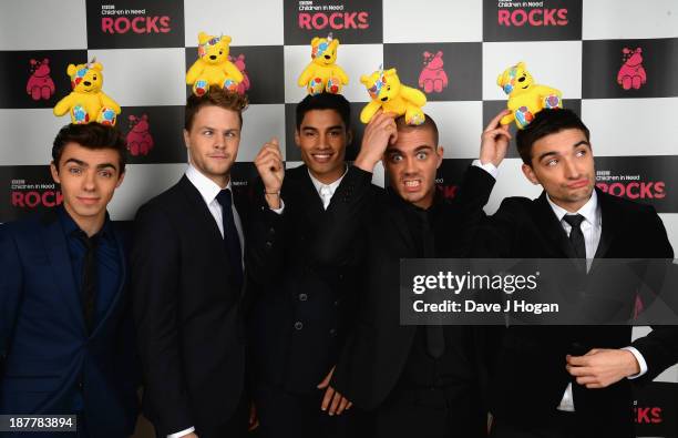 Nathan Sykes, Jay McGuiness, Siva Kaneswaran, Max George and Tom Parker of The Wanted pose backstage during the 'BBC Children In Need Rocks' at...