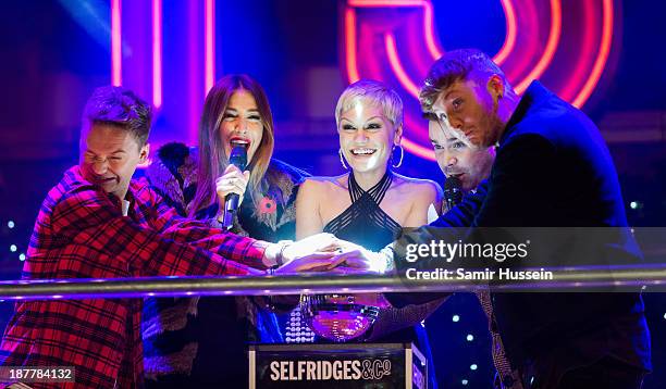 Conor Maynard, Lisa Snowdon, Jessie J, Dave Berry and James Arthur switch on the Oxford Street Christmas lights at Selfridges on November 12, 2013 in...