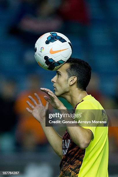 Pedro Rodriguez Ledesma of FC Barcelona saves on a header during his warming up prior to start the La Liga match between CA Osasuna and FC Barcelona...