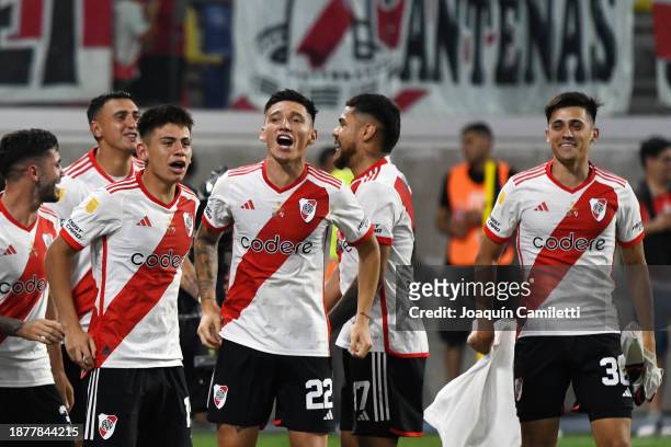 Claudio Echeverri, Matías Kranevitter and Pablo Solari of River Plate celebrate winning the Trofeo de Campeones match between Rosario Central and...