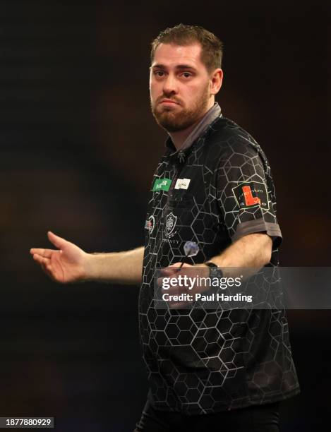 Berry van Peer of Netherlands reacts during day nine of the 2023/24 Paddy Power World Darts Championship at Alexandra Palace on December 23, 2023 in...