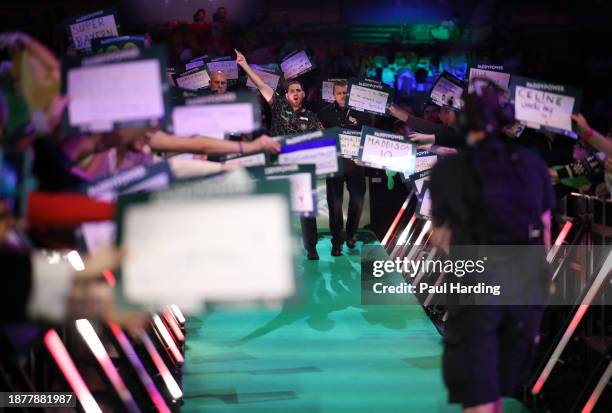 Berry van Peer of Netherlands reacts as they walk on during day nine of the 2023/24 Paddy Power World Darts Championship at Alexandra Palace on...