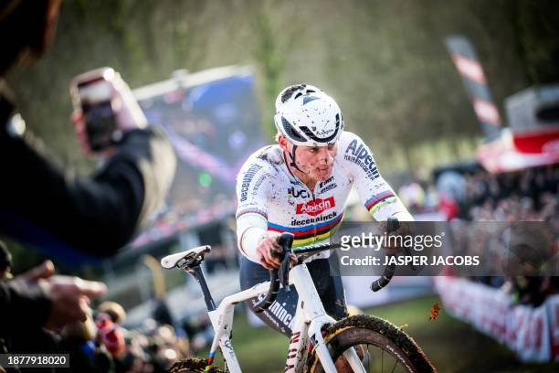 Dutch Mathieu Van Der Poel competes during the men's elite race of the World Cup cyclocross cycling event in Gavere on December 26 stage 10 of the...