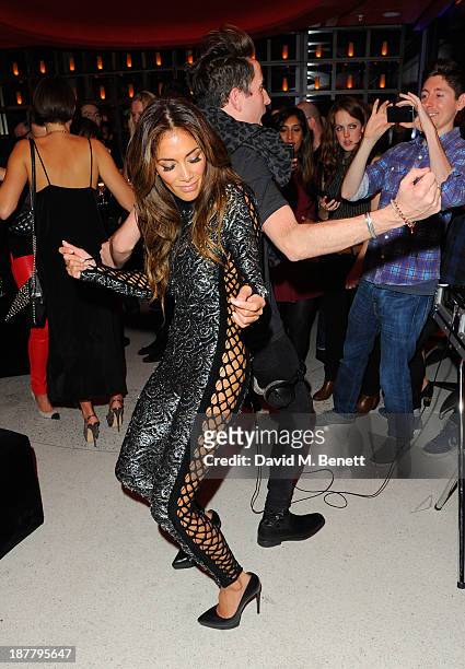 Nicole Scherzinger and Nick Grimshaw attend the first anniversary party of Sushi Samba at Sushi Samba on November 12, 2013 in London, England.