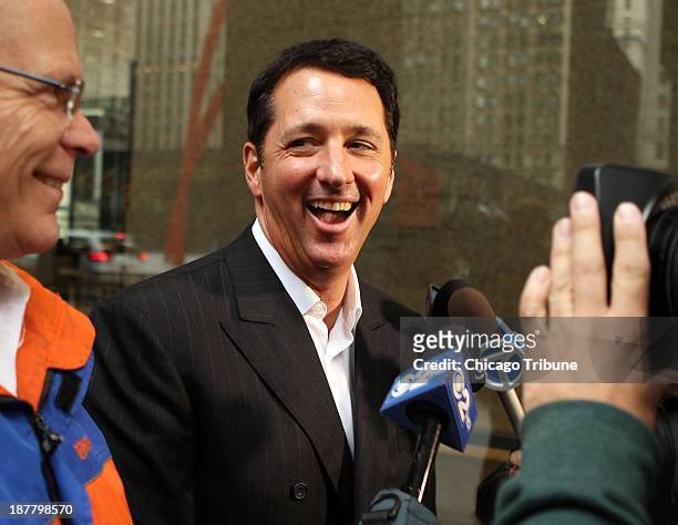 Kevin Trudeau, center, leaves the Dirksen U.S. Courthouse in Chicago on October 16, 2013. The TV pitchman was found guilty of criminal contempt for...