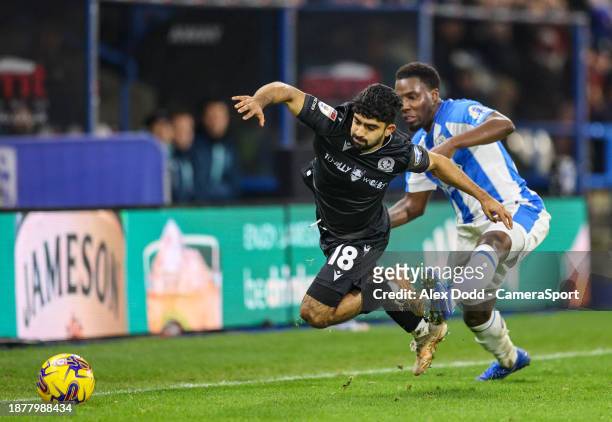 Blackburn Rovers' Dilan Markanday is fouled by Huddersfield Town's Jaheim Headley during the Sky Bet Championship match between Huddersfield Town and...