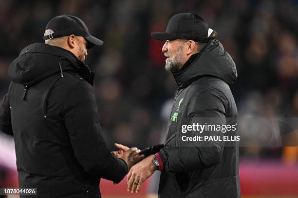 Burnley's Belgian manager Vincent Kompany shakes hands with Liverpool's German manager Jurgen Klopp ahead of kick-off in the English Premier League...