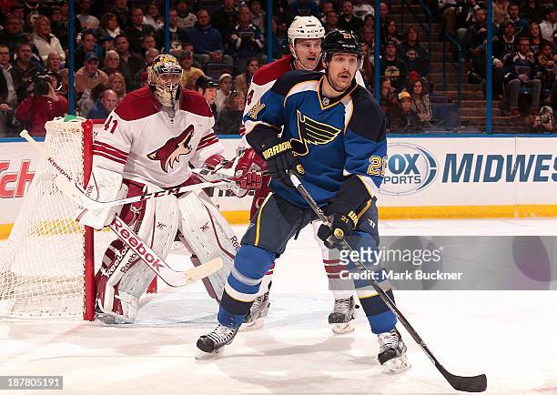 Patrik Berglund of the St. Louis Blues looks for a pass as Zbynek Michalek and goalie Mike Smith of the Phoenix Coyotes defend on November 12, 2013...