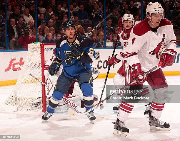 Jaden Schwartz of the St. Louis Blues takes position in front of the net as Zbynek Michalek and Oliver Ekman-Larsson of the Phoenix Coyotes defend on...