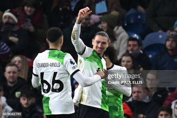 Liverpool's Uruguayan striker Darwin Nunez celebrates with teammates after scoring the opening goal of the English Premier League football match...