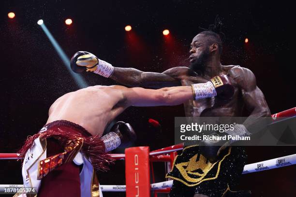 Deontay Wilder and Joseph Parker exchange punches during the WBC International & WBO Intercontinental Heavyweight title fight between Deontay Wilder...